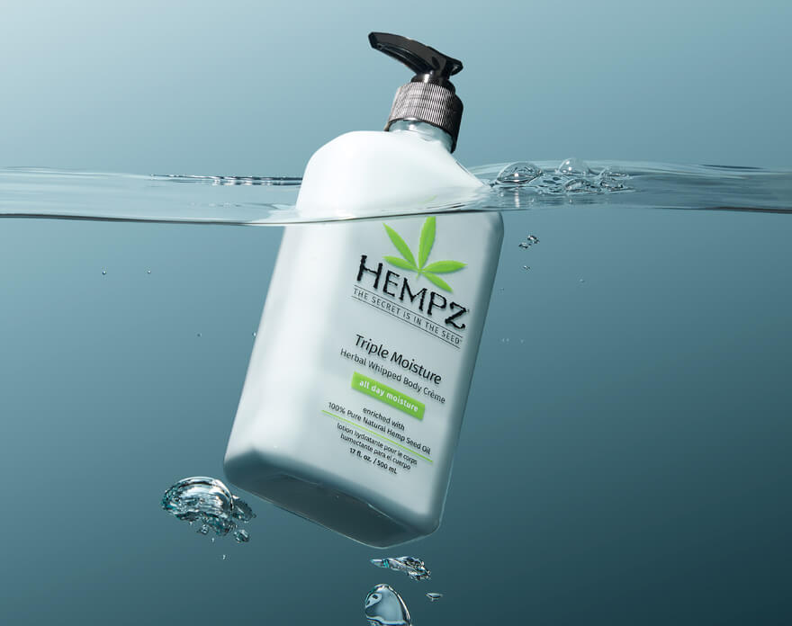 Hempz Triple Moisture Body Creme Lotion for Dry Skin floating in water